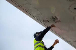 technician checking a plane