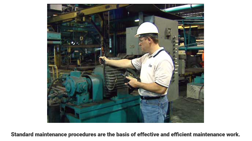 Technician inspecting industrial machine as part of standard maintenance procedure