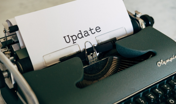 A sheet of paper reading “Update” inserted into a vintage typewriter.