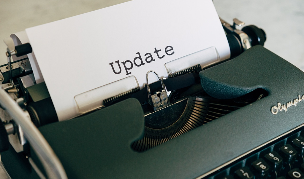 A sheet of paper reading “Update” inserted into a vintage typewriter.
